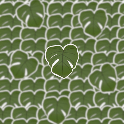 This Monstera Leaf Sticker features a digital illustration of multiple green monstera leaves adorned with white outlines, intricately arranged to create a decorative sticker. Ideal for plant enthusiasts, the central leaf is prominently highlighted.