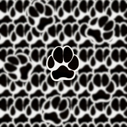 The Puppy Paw Sticker features a bold black and white paw print at its center, encircled by a series of smaller paw prints. Ideal for dog enthusiasts, this charming sticker enhances any surface with its whimsical design.